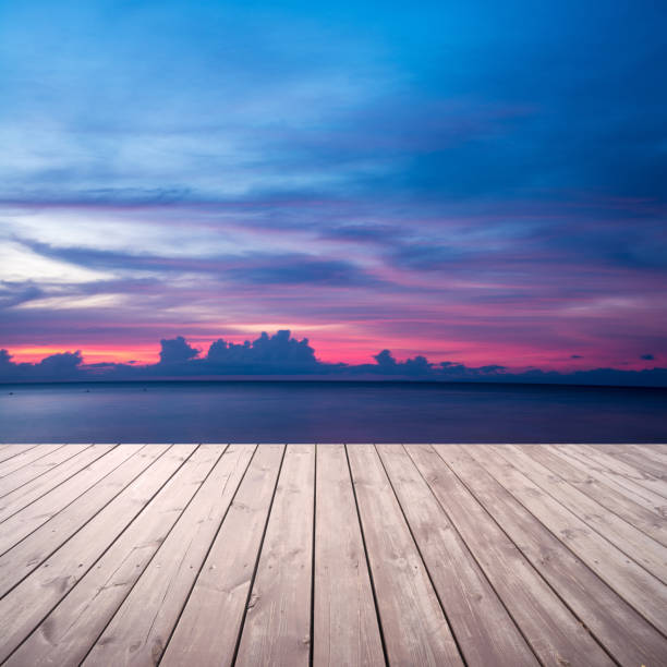 istock Wooden platform on beach with seascape and cloudy sky 481939530