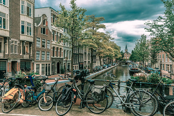istock Amsterdam canal and bridge with bikes, Holland 481940290