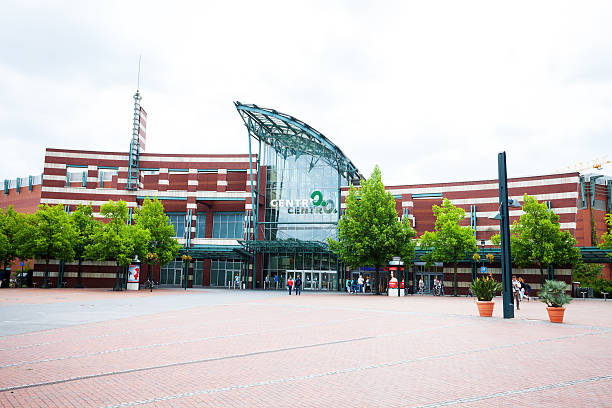 Oberhausen, Germany - June 16, 2015: Capture of shopping mall CentrO in Oberhausen Neue Mitte at summertime. A few people are walking outside over square. Forenoon shot.