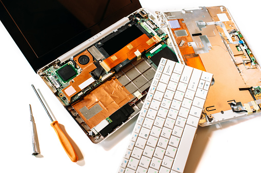 Repair set of the disassembled broken computer (laptop). The isolated image on a white background