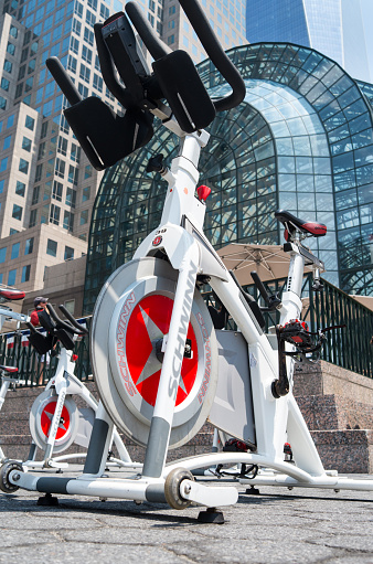 New York City, USA - July 12, 2015: Close-up of Schwinn stationary bike photographed outside the World Financial Center on the Promenade and set up for an outdoor spin class in Lower Manhattan.
