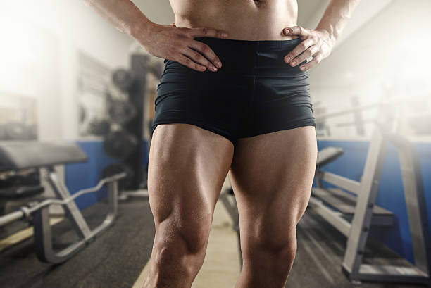 Never Skip Leg Day Close up of strong muscular men`s legs in the gym. human leg stock pictures, royalty-free photos & images