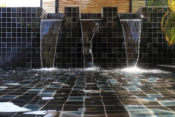 istock flowing water decorated in swimming pool 481945674