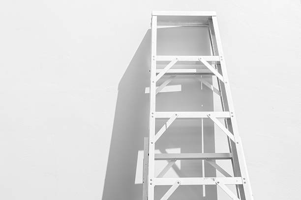 istock Rustic ladder leaning against a wall in the sunlight 481946346