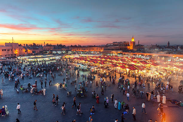 Evening Djemaa El Fna Square with Koutoubia Mosque, Marrakech, Morocco Famous Djemaa El Fna Square in early evening light, Marrakech, Morocco with the Koutoubia Mosque, Northern Africa.Nikon D3x djemma el fna square stock pictures, royalty-free photos & images