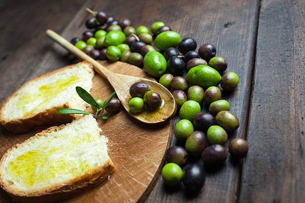 istock olive oil and bread on rustic wooden table 481949720