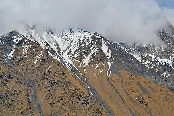 istock Snow-capped mountains in the clouds. Caucasus mountains, Georgia 481950952