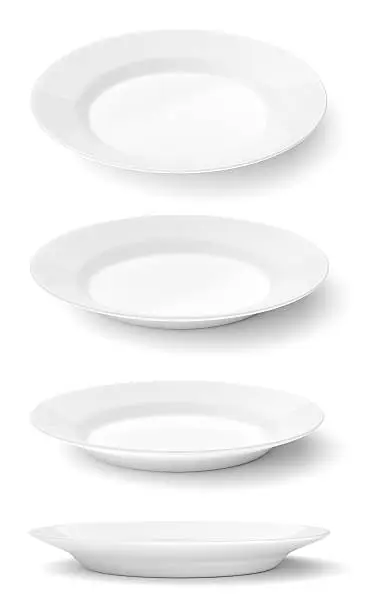Set of empty ceramic round plates isolated on white background