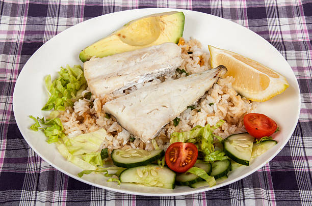 istock Baked Fish on Fried Rice with Avocado and Salad 481952890