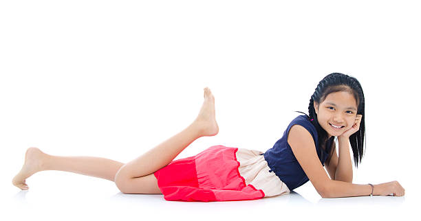 Woman on black elegant dress, lying on floor