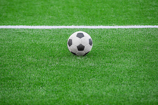 istock soccer ball on green grass 481957309
