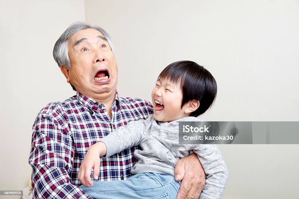 Grandpa and great-grandchild Japanese man playing with great-grandson Senior Men Stock Photo