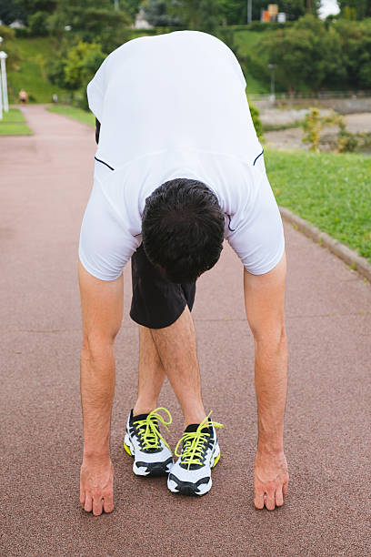 istock Sportsman doing stretching exercises outdoors 481962774