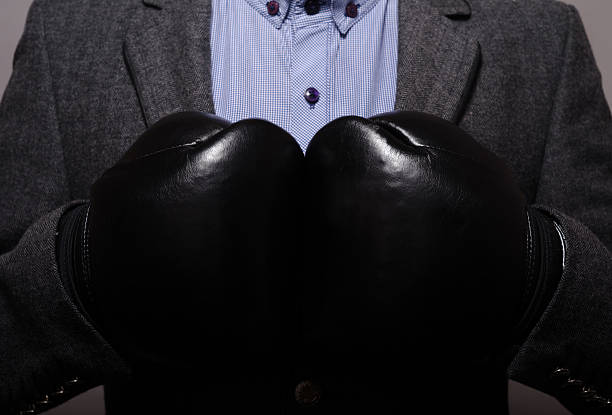 istock businessman in black boxing gloves 481962884