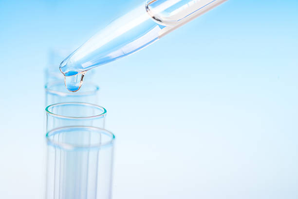istock Scientific background: drop from pipette falling in a tube 481962920