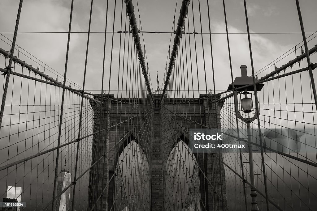 Monochromatic Brooklyn Bridge The Iconic Brooklyn Bridge at sunrise with a rain storm moving in. 2015 Stock Photo
