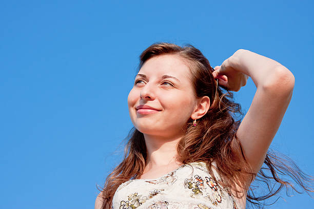 istock woman on a background blue sky 481963965