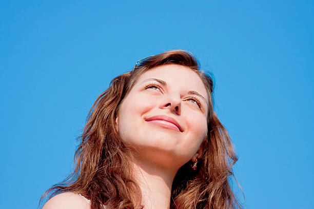 istock woman on a background blue sky 481964005