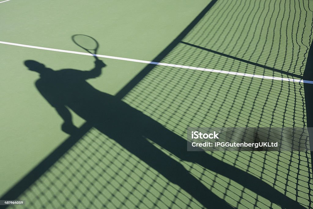 Shadow of senior man playing tennis on court 60-69 Years Stock Photo