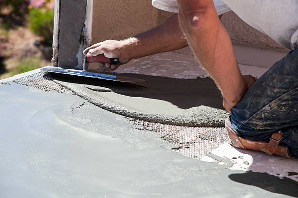 Floor repair Construction worker with concrete repairing balcony stucco repair stock pictures, royalty-free photos & images