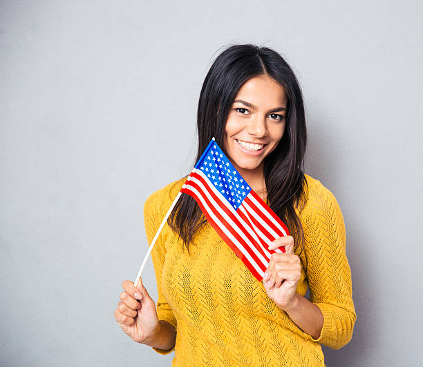 istock Young woman holding american flag 481967950