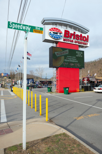 Bristol, Tennessee, USA - March 14, 2014: Sign for Bristol Motor Speedway during NASCAR race weekend in Bristol, Tennessee. People are visible in the background.