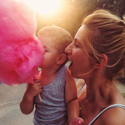 Photo of a mother and son eating cotton candy // mobile stock photo, made with iPhone 5