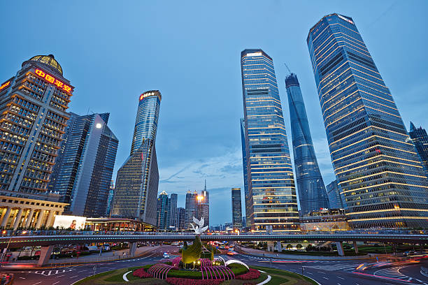 istock Asphalt road and modern city shanghai at night 481969234