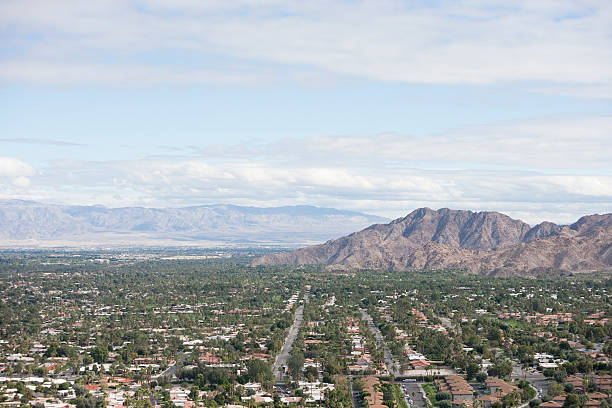 istock Residential district and mountains against cloudy sky 481971783