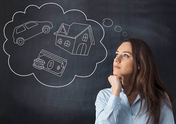 Young woman with her dreams Businesswoman thinking her dreams on blackboard day dreaming stock pictures, royalty-free photos & images