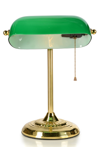 Vintage desk lamp with green glass shade isolated over white background - With clipping path