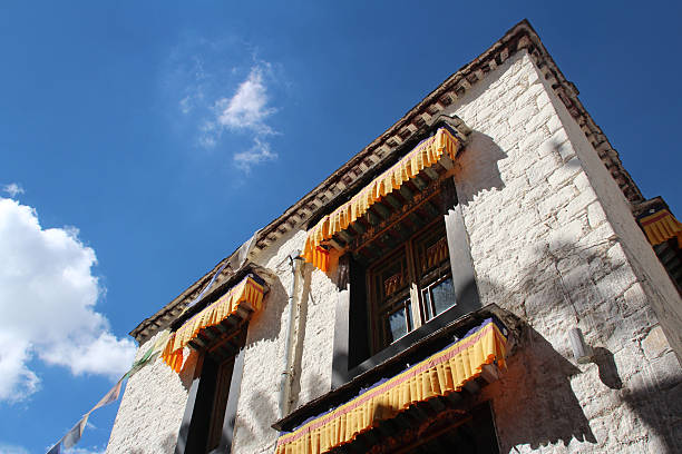 Tibet, China- September 9, 2014: A typical Tibetan architectural feature is painted black frames around windows on the building