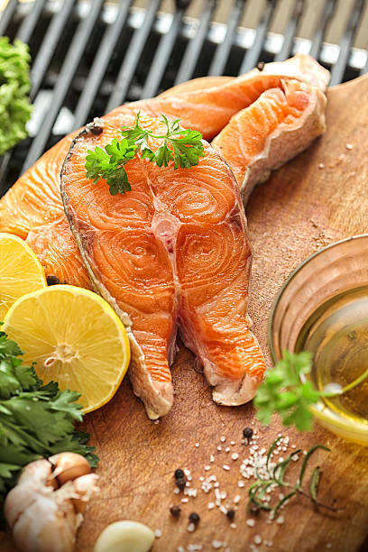 istock Grilled salmon steaks and fresh vegetables 481980500
