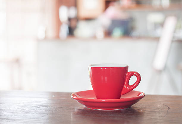 istock Red coffee cup on wooden table 481981754