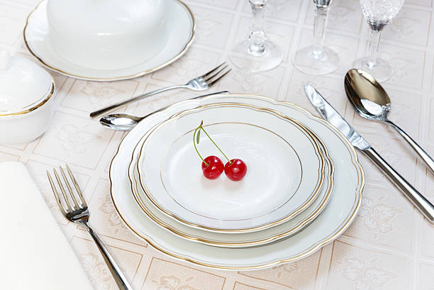 istock Two cherries lie on a white porcelain plate 481985928