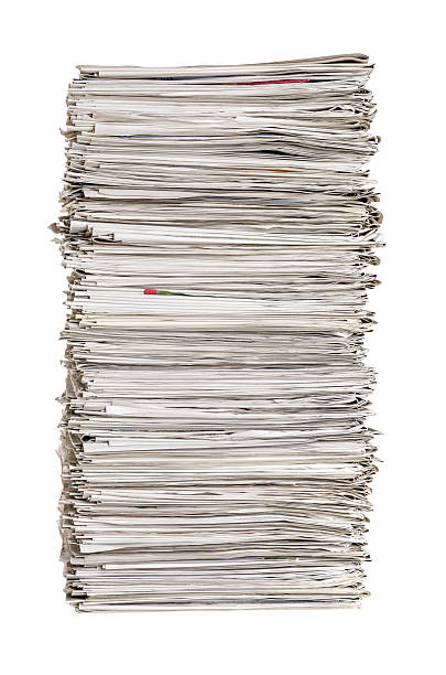 istock Isolated pile of newspapers on a white background 481986158