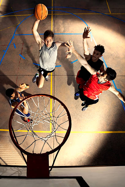 istock young basketball players playing with energy 481986996