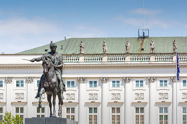 WARSAW. POLAND - AUGUST 2015: Presidential Palace Palac Prezydencki, 1643 in Warsaw, Poland. Equestrian statue of Prince Jozef Poniatowski. Statue of a lion. High quality photo