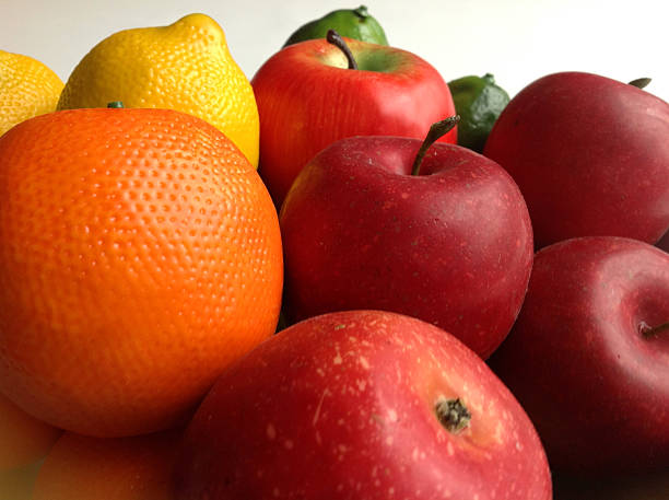 istock Image of artificial fruit, including plastic oranges and wax apples 481989125