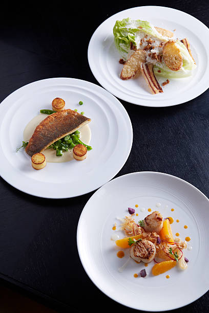 Three plates of food on table