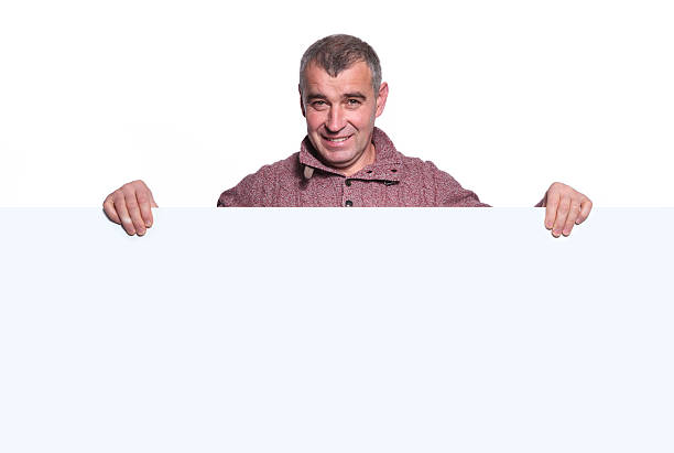 istock smiling casual old man holding a big blank board 481989927