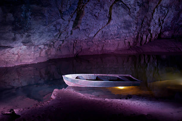 Boat in the cave stock photo