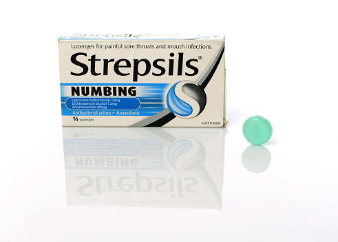 Sydney, Australia - July 20, 2015:  A box of Strepsils numbing anaesthetic lozenges for painful sore throats and mouth infections.  Shot in the studio and isolated on white.