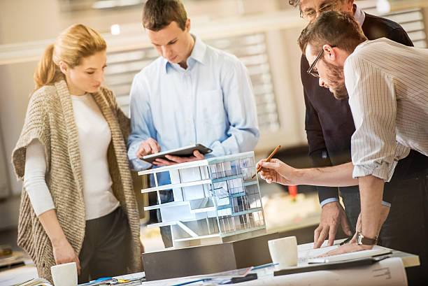istock Close up of architects team working on project plan 481991800
