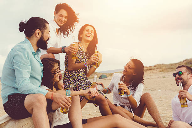 istock Best friends drinking beer at the beach 481993798