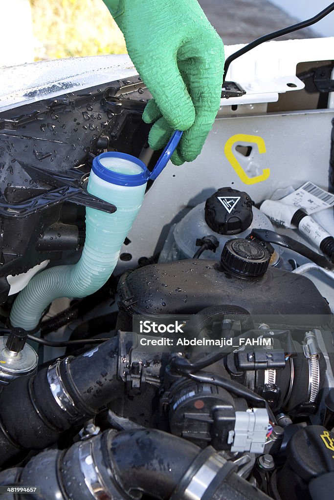 checking water level Humain hand checking car cooling water Abstract Stock Photo