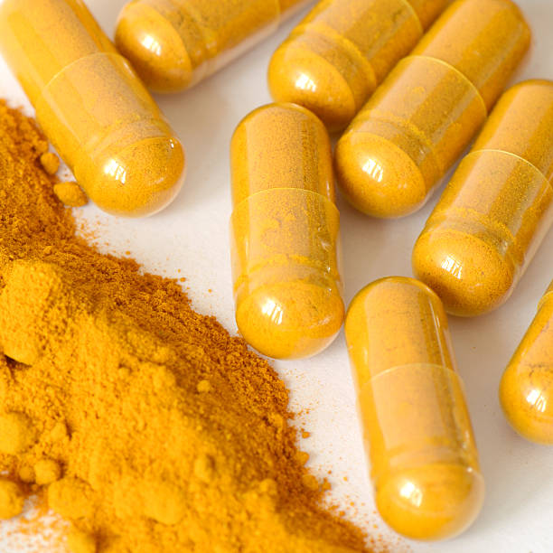 istock Tumeric powder and herbal medicine products 481994925