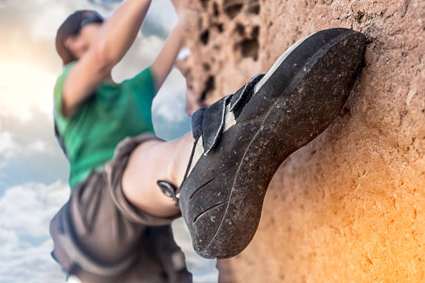 istock Women Rockclimber on A DIme Edge 481995438