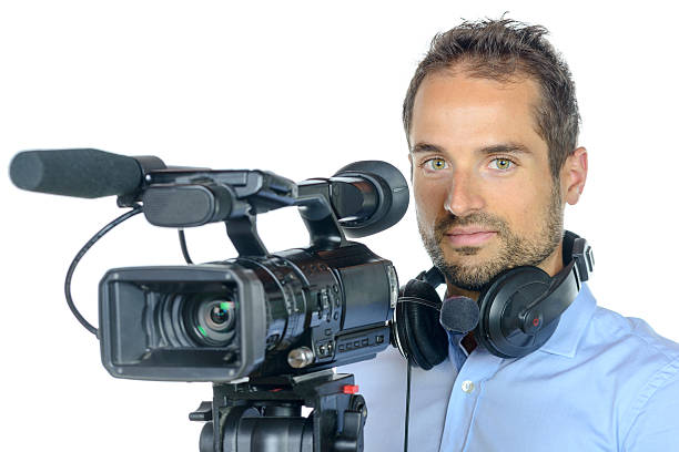 istock Young man with professional movie camera 481998438