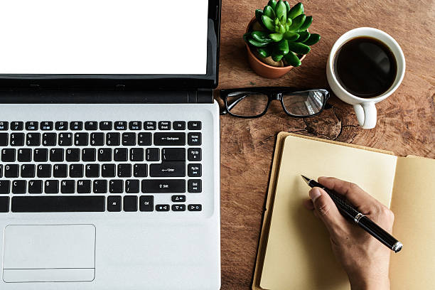 istock Laptop and cup of coffee with hand working 481998494